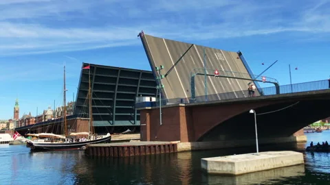 Old schooner ship passing through a drawbridge Stock Footage 202163906