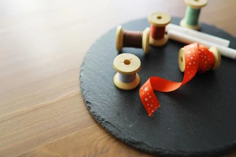Old scissors, spools of colored thread, centimeter and tailors chalk, flat .. Stock Photos