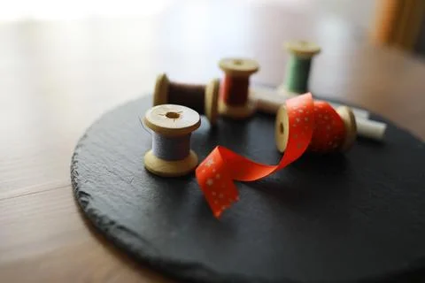 Old scissors, spools of colored thread, centimeter and tailors chalk, flat .. Stock Photos