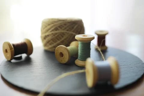 Old scissors, spools of colored thread, centimeter and tailors chalk, flat .. Stock Photos