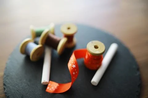 Old scissors, spools of colored thread, centimeter and tailors chalk, flat .. Stock Photos