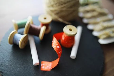 Old scissors, spools of colored thread, centimeter and tailors chalk, flat .. Stock Photos