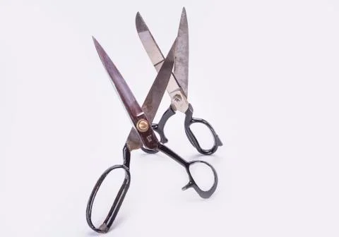 Old scissors two pairs on white background standing up. Stock Photos