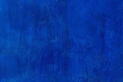 Old scratched and chapped painted royal blue wall Stock Photos