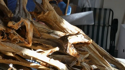 OLD Seafood processing factory preparing cod fish. Hand made. Man cut the codfis Stock Footage 99738577