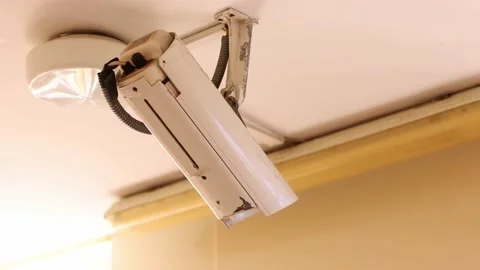 Old security control camera on a ceiling. 4K Stock Footage 197416529