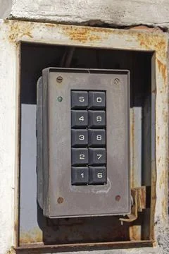 Old security keypad for pin code entrance Stock Photos