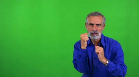 Old senior man does karate - green screen - studio Stock Footage