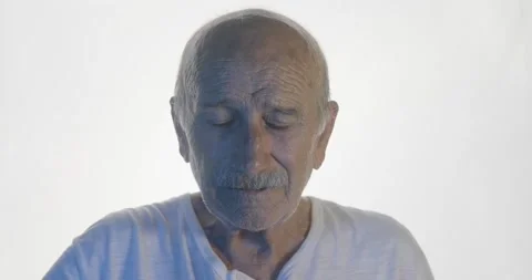 An old senior man has headache. Illness, depression and pain concept with stress Stock Footage 136765172