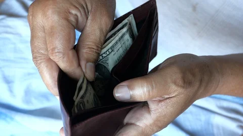 Old senior man having some money in his wallet. Stock Footage 127729248