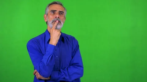 Old senior man walks and thinks about something - green screen - studio Stock Footage