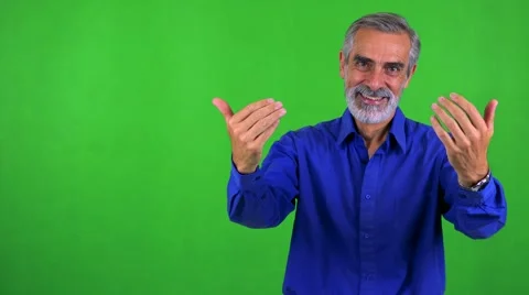 Old senior man welcomes - green screen - studio Stock Footage