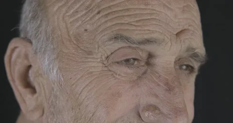 Old senior man's close up, macro shot of smiling eyes. Happy retired grandpar Stock Footage 142099843
