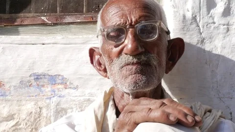 Old senior from a small village using glasses in India Video stock 70810139
