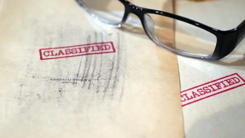 An old  sensitive documents and secret information with the stamp CLASSIFIE.. Stock Footage 317199337