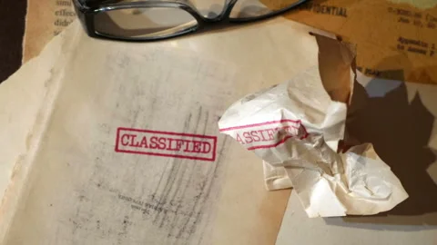 An old  sensitive documents and secret information with the stamp CLASSIFIE.. Stock Footage 320083563