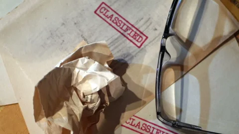 An old  sensitive documents and secret information with the stamp CLASSIFIE.. Stock Footage 320083607