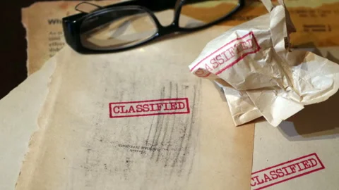 An old  sensitive documents and secret information with the stamp CLASSIFIE.. Stock Footage 321372818