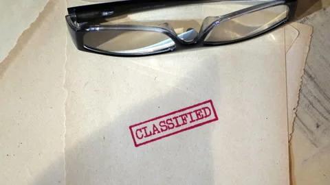 An old  sensitive documents and secret information with the stamp CLASSIFIE.. Stock Footage 321431004