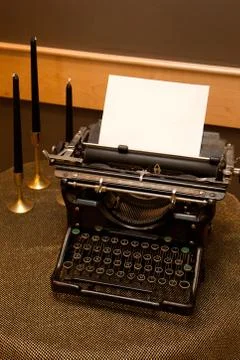 Old set typewriter with candles Stock Photos