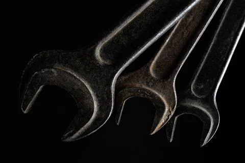 Old set of wrench tools on black background. Foto stock