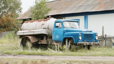 An old sewage disposal machine standing next to the house. Stock Footage 280771025