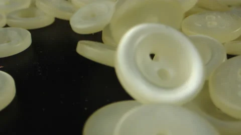 Old sewing buttons close-up. Yellowed by time buttons for sewing. Concept of Stock Footage 194959033