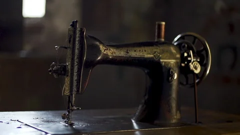 Old Sewing Machine with dust particles behind Stock Footage 128785710