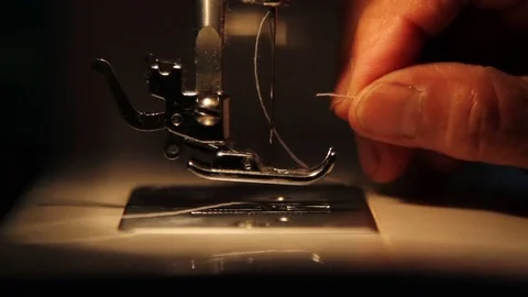 Old sewing machine insert thread Stock Footage 84068274