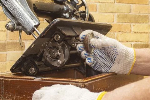 Old sewing machine, service Stock Photos