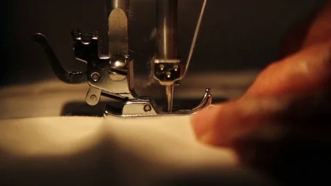 Old sewing machine stitching on white fabric 動画素材 84068267