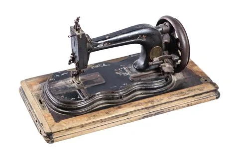 The old sewing machine on a white background Stock Photos