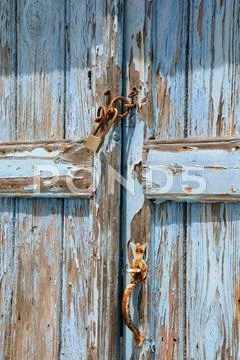 Old shabby unpainted door Stock Photos