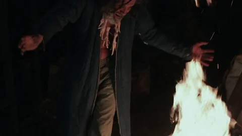 The old shaman dances around the fire Stock Footage 72573938