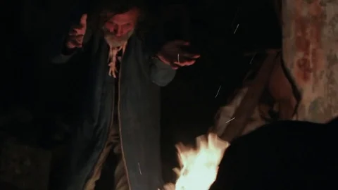The old shaman dances around the fire 스톡 동영상 72574822