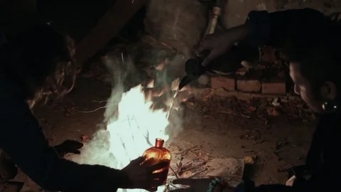 The old shaman dances around the fire Stock Footage 72575426