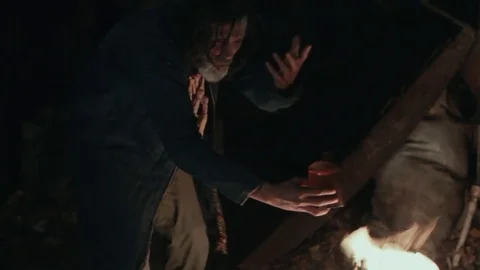 The old shaman dances around the fire Stock Footage 72601321