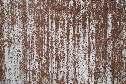 Old sheet of iron covered with rust with white colored paint . Rusty metal .. Stock Photos
