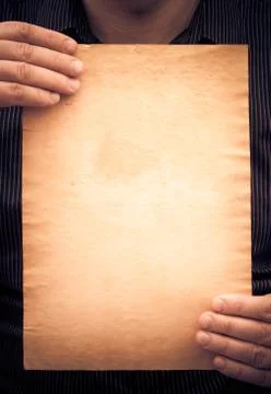 Old sheet paper hands vertically Stock Photos