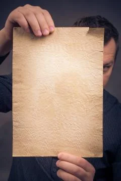Old sheet paper hands vertically Stock Photos