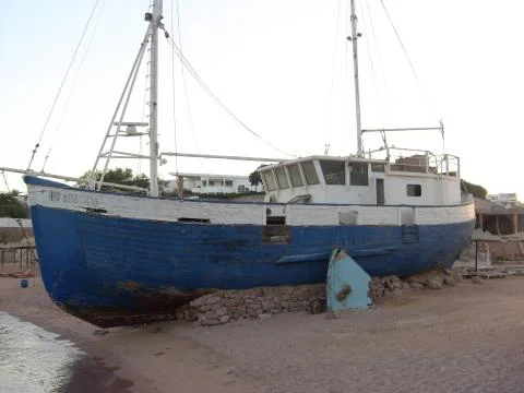 Old ship model on beach of sharks bay sharm el sheikh Sinai Egypt Stock Photos