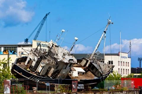 Old ship wreck in the docks Stock Photos