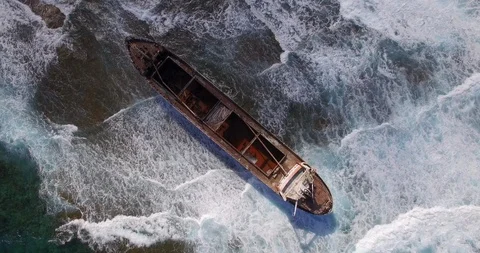 Old shipwreck in hi waves Stock Footage 90523936