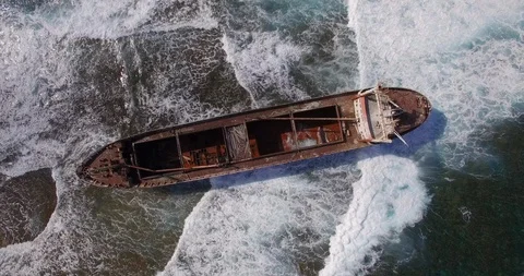 Old shipwreck in hi waves Stock Footage 90524173