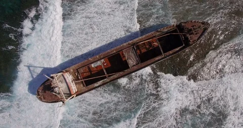 Old shipwreck in hi waves Stock Footage 90524425