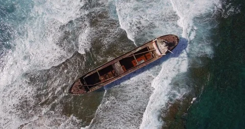 Old shipwreck in hi waves Stock Footage 90524661