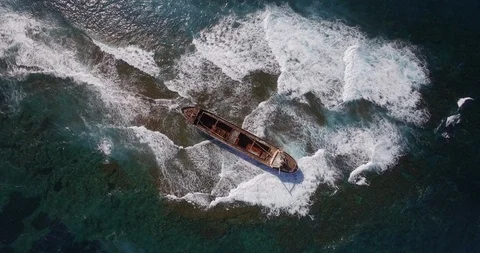 Old shipwreck in hi waves Stock Footage 90524848
