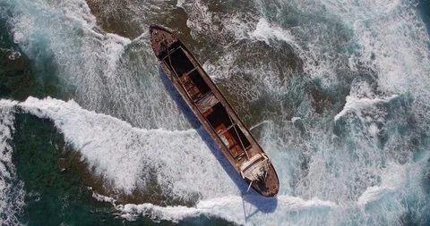 Old shipwreck in hi waves Stock Footage 90524904