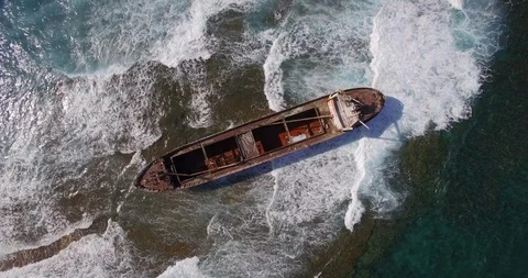 Old shipwreck in hi waves Stock Footage 90524941
