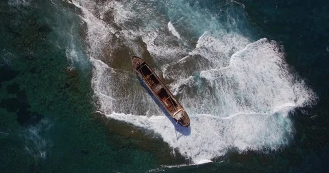 Old shipwreck in hi waves Stock Footage 90525026